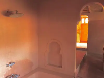 a bathroom with a sink and a mirror at Kasbah Alami in Kalaat MGouna