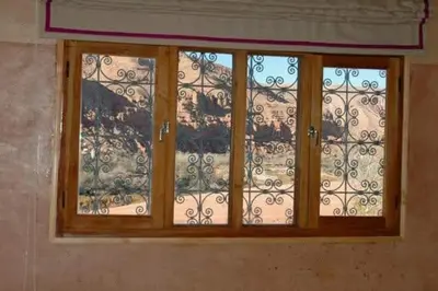 a window in a bathroom with a curtain at Kasbah Alami in Kalaat MGouna