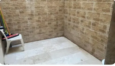 a corner of a room with a brick wall at Très bel Apt Fès,3 ch dans un quartier trop chic bien placé in Fès