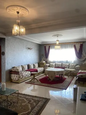 a living room with a couch and a table at Luxury Apartment Meknes in Meknès