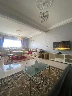 a large living room with a couch and a table at Luxury Apartment Meknes in Meknès