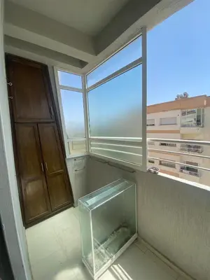 an empty room with a fish tank in a window at Luxury Apartment Meknes in Meknès
