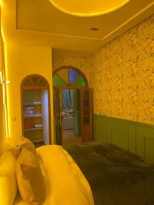a bedroom with a large bed in a room at Vintage Green House in Fès