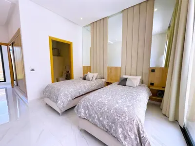 a bedroom with two beds and a window at villa Elyssa !Confort & modern avec Piscine privée in Marrakech