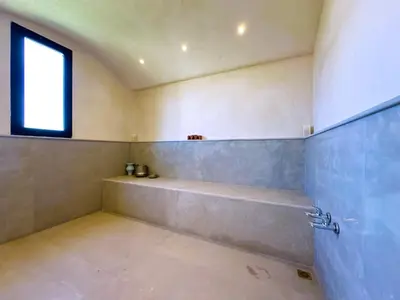 a large bathroom with a tub and a window at villa Elyssa !Confort & modern avec Piscine privée in Marrakech