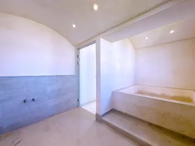 a bathroom with a tub in the corner of a room at villa Elyssa !Confort & modern avec Piscine privée in Marrakech