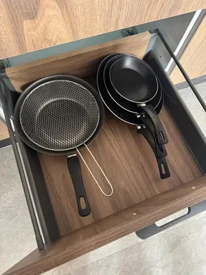 a drawer with two utensils and a strainer at Studio plein centre-ville ! in Fès