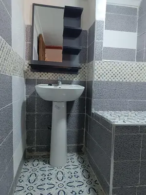 a bathroom with a sink and a mirror at Riad Amira Fes in Fès