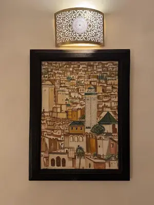a picture of a painting of a city on a wall at Appartement Dar LALA 2 in Fès