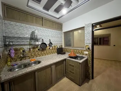 a kitchen with a sink and a counter top at apartment for guests in Demnat