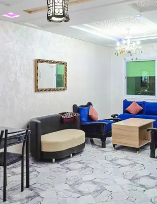 a living room with couches and a table at Appart Hotel Bab Fes Medina - For Families & Travelers in Fès