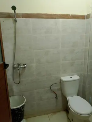 a bathroom with a toilet and a shower at apartment near Super Market in Meknès
