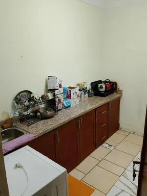 a kitchen with a counter top with a sink at apartment near Super Market in Meknès