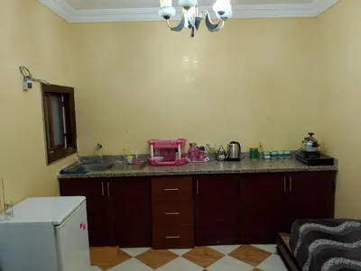 a kitchen with a counter with a pink appliance on it at شقة مفروشة بمكناس قرب مركز التسوق مرجان in Meknès