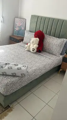 two stuffed animals are sitting on a bed at واد فاس طريق مكناس تجزئة البركه قرب طريق الجامعه المتوسطه لاغوميد in Fès