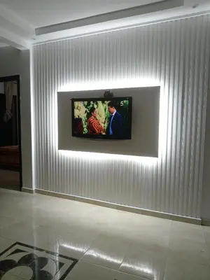 a television on a wall in a room at Coin des bons moments in Marrakech