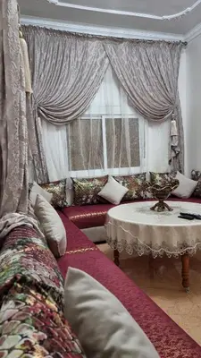 a living room with a couch and a table at Maison Taha in Azrou