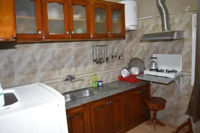 a kitchen with a sink and a counter top at Maison Taha in Azrou