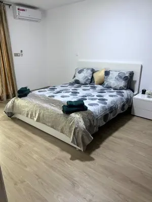 a large bed in a room with at Escapade à Fes in Fès