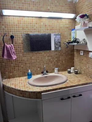a bathroom counter with a sink and a mirror at Escapade à Fes in Fès