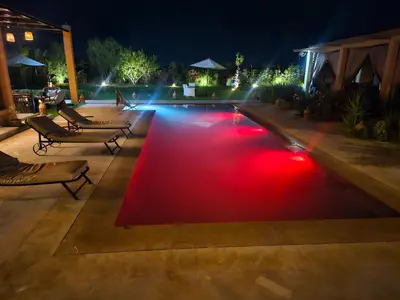 a red carpet on a patio at night at bled ghazal in Marrakech