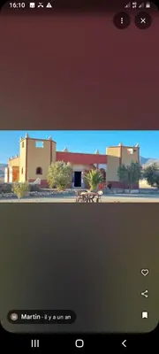 a view of a building with a picnic table at Gueste housse ait hani in Aït Hani