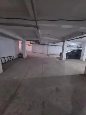 an empty parking garage with a car parked in it at Prestige Immo in Fès