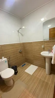 a bathroom with a toilet and a sink at Prestige Immo in Fès