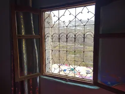 a view of a dog through a window at Gite Soleil Private House in Tacheddirt