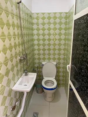 a small bathroom with a toilet and a sink at siti fadma ourika Marrakech in Aghbalou