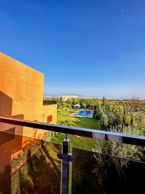 a view from the balcony of a house with a pool at Tasnim VILLA in Marrakech