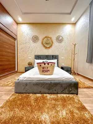 a bedroom with a bed with a welcome sign on it at Tasnim VILLA in Marrakech
