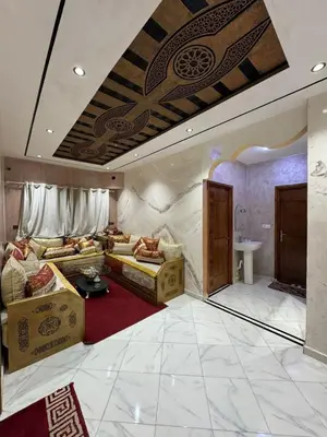 a living room with a couch and a room with a ceiling at house Perfect well equipped in Midelt