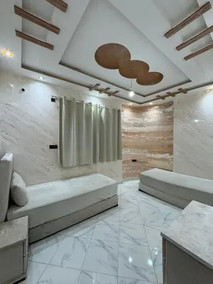 a living room with two beds and a curtain at house Perfect well equipped in Midelt