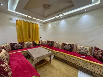 a living room with a couch and a table at house Perfect well equipped in Midelt