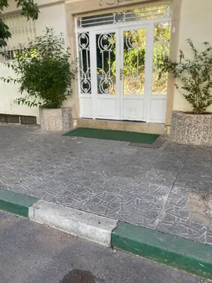 a front door of a building with a gate at Appartement luxueuse au centre ville de Fès in Fès