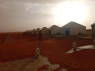 a row of tents in the middle of a desert at Merzouga morocco in Tisserdmine