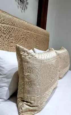a couple of pillows sitting on a bed at Fassia in Fès