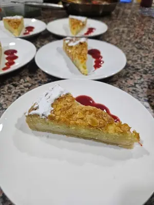 a piece of pie on a white plate on a table at Fassia in Fès