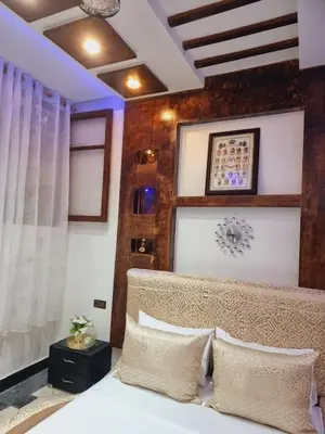 a bedroom with a bed with two pillows at Fassia in Fès