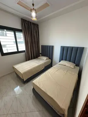 a bedroom with two beds and a window at Charming Spacious Gem Near Fes Medina in Fès
