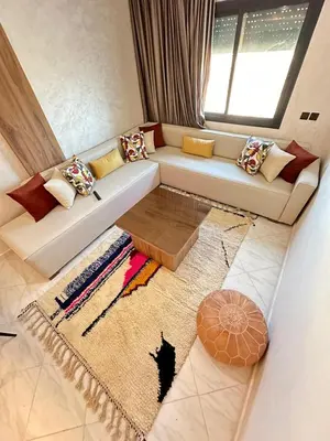 a living room with a couch and a window at Charming Spacious Gem Near Fes Medina in Fès