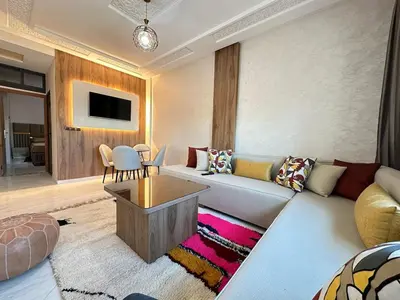a living room with a couch and a table at Charming Spacious Gem Near Fes Medina in Fès