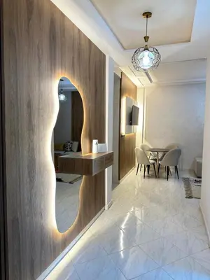 a hallway with a table and a dining room at Charming Spacious Gem Near Fes Medina in Fès