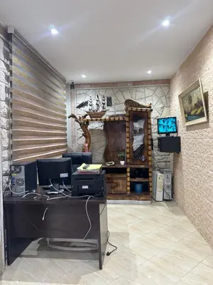 an office with a desk with a computer on it at Gîte - Auberge PYRAMIDES Bab Boudir in Bab Boudir