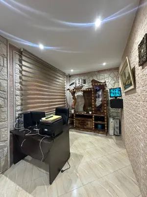 an office with a desk with a computer in it at Gîte - Auberge PYRAMIDES Bab Boudir in Bab Boudir