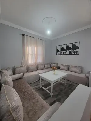 a living room with a couch and a table at Ourika Valley Haven - Breathe, Relax, Unwind in Ourika