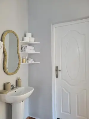 a white bathroom with a sink and a mirror at Ourika Valley Haven - Breathe, Relax, Unwind in Ourika