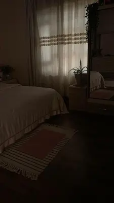 a bedroom with a bed and a mirror and a window at aLO MARRAKECH in Kasba Aït Youdi