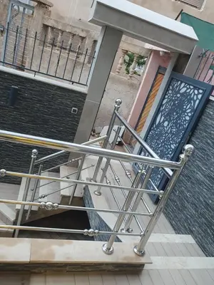 a metal railing in front of a building at Dar diafa in Imouzzer Kandar